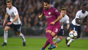 Manchester City bounce back to put one hand on Premier League title