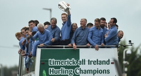 William O'Donoghue raises the Liam McCarthy Cup alongside manager John Kiely and members of the team as the bus makes its way to the Gaelic Grounds in Limerick. Photo: Diarmuid Greene/Sportsfile