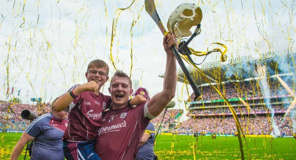 Joe Canning celebrate's Galway's All-Ireland win with Niall Donoghue, son of team manager Micheál