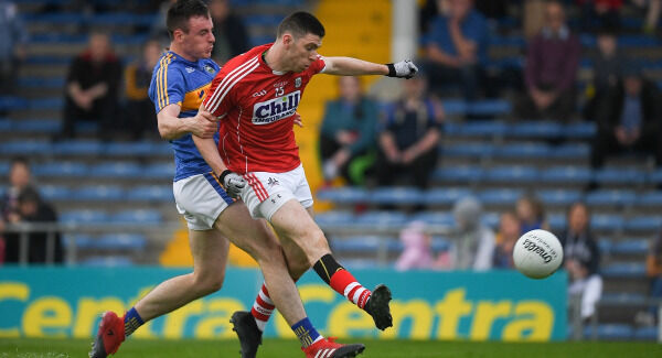 Luke Connolly of Cork in action against Alan Campbell of Tipperary. Pic: Sportsfile