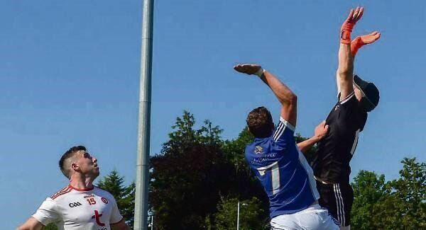 Tyrone goalkeeper Michael O’Neill and Cavan half-back Fergal Reilly reach high for a dropping ball in theAll-Ireland SFC Round 3 qualifier in Enniskillen on Saturday. Picture: Eóin Noonan Tyrone goalkeeper Michael O’Neill and Cavan half-back Fergal Reilly reach high for a dropping ball in theAll-Ireland SFC Round 3 qualifier in Enniskillen on Saturday. Picture: Eóin Noonan