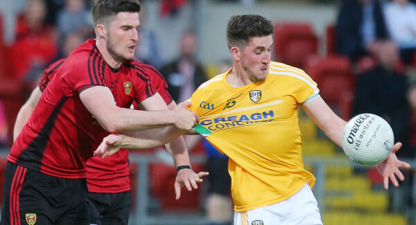 Down's Ryan Johnston with Antrim's Ryan Murray. Pic: ©INPHO/Jonathan Porter