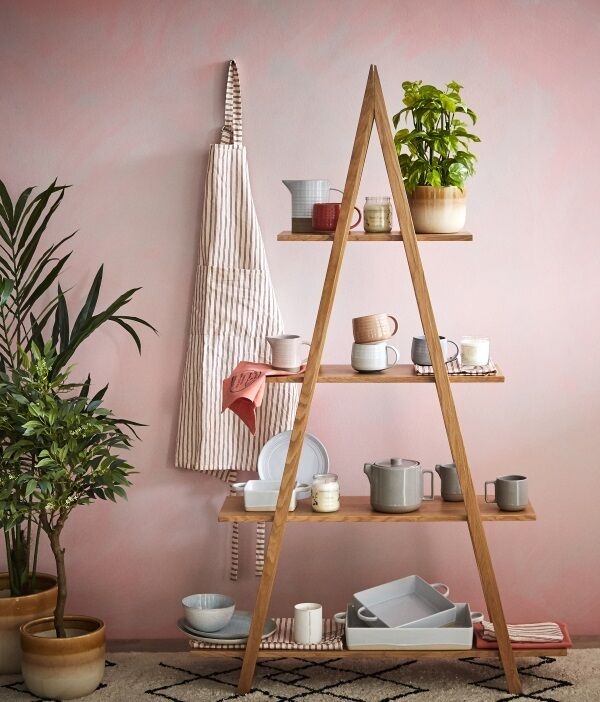 Products from the Considered range by Helen James at Dunnes Stores. Triangle Shelf €125; Rego Oven to Tableware from €10; Fruit Jar Candle €8; Cotton/Linen Mix Stripe Apron €18; Ripple Mug €5