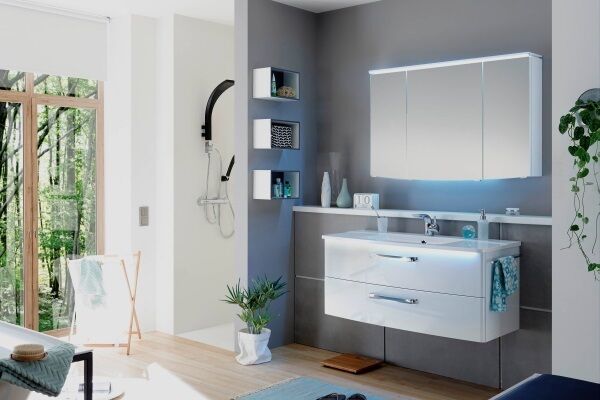 Two walls provide a discreet walk-in. Here, matched to black shower fittings, sleek slab furniture byPeripal, from €1,995. Use water-resistant, engineered laminate or wood-look tile, from €25m, overreal-wood board floors. City Bathrooms & Tiles.