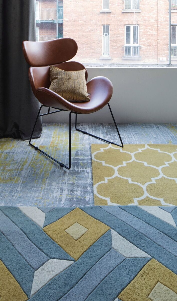 Rugs are an easy way to warm up that suspended floor; ochre rug, €130, Harvey Norman.