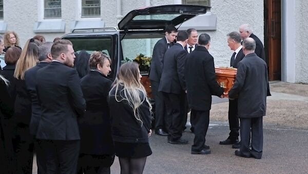 The coffin of Shaun Harkin is carried into Christ the King Church. Picture: Niall Carson/PA Wire The coffin of Shaun Harkin is carried into Christ the King Church. Picture: Niall Carson/PA Wire