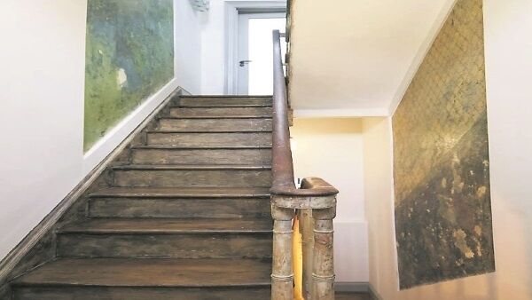 Years of decorating is exposed on the staircase and framed by new plaster to create unique artworks which tells of the house’s history. The old wall décor adds to the unique style of the house. Years of decorating is exposed on the staircase and framed by new plaster to create unique artworks which tells of the house’s history. The old wall décor adds to the unique style of the house.