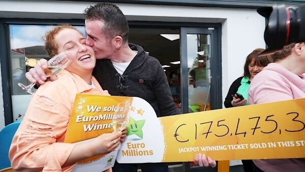 Les Reilly kisses his niece Carly Reilly outside Reilly's Daybreak in Naul, Co Dublin, as they celebrate selling the EuroMillions €175m-winning ticket. Les Reilly kisses his niece Carly Reilly outside Reilly's Daybreak in Naul, Co Dublin, as they celebrate selling the EuroMillions €175m-winning ticket.