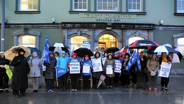 A group taking part in the INMO strike outside the Mercy University Hospital, Cork. Picture Denis Minihane.