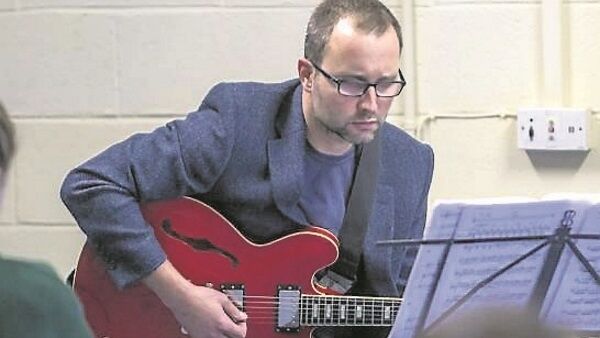 Chris Montague performing for the students in Cashel.