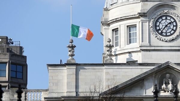 The flag flew at half mast at Government Buildings as a mark of respect during Emma Mhic Mhathúna's funeral. Pic: Leah Farrell/RollingNews.ie