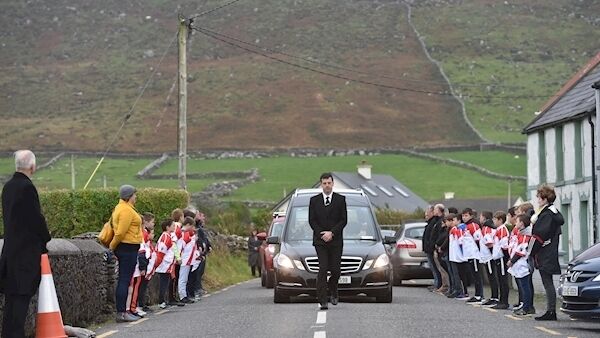 The funeral cortege with a guard of honour from the local GAA club at the funeral mass for Emma Mhic Mhathúna at Seipeal na Carraige, Baile na nGall, Co Kerry. Picture Dan Linehan