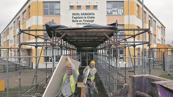 Builders carry out remedial work yesterday at Tyrrelstown Educate Together School. The school closed to pupils last week due to building defects . Picture: Colin Keegan Builders carry out remedial work yesterday at Tyrrelstown Educate Together School. The school closed to pupils last week due to building defects . Picture: Colin Keegan