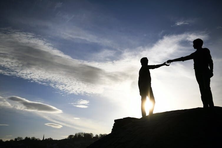 Hands across the divide – a sculpture in Londonderry. Neil Hall/EPA