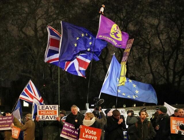 Protesters outside the House of Commons (PA)