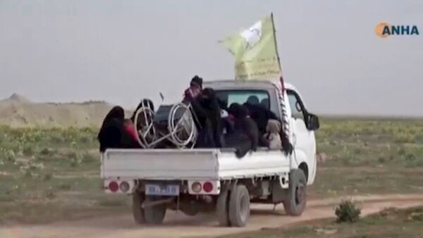 Civilians flee fighting near Baghouz, Syria, on Sunday. Pic: AP Civilians flee fighting near Baghouz, Syria, on Sunday. Pic: AP