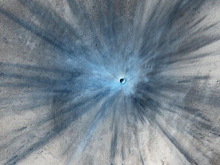 A 30 metre crater on Mars created by an impact sometime between 2010 and 2012. NASA/JPL-Caltech/University of Arizona