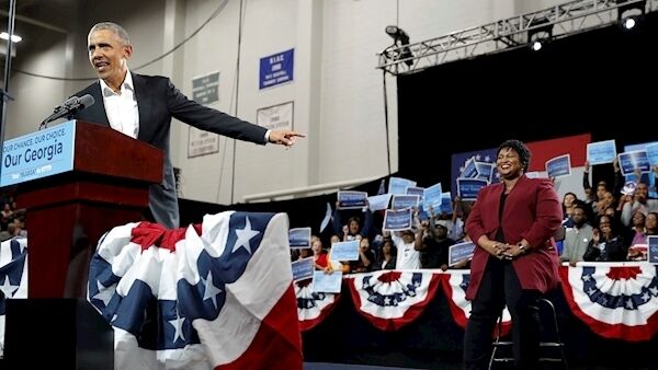 Former president Barack Obama points to Democratic candidate Stacey Abrams at a rally in Atlanta. Picture: John Bazemore/AP