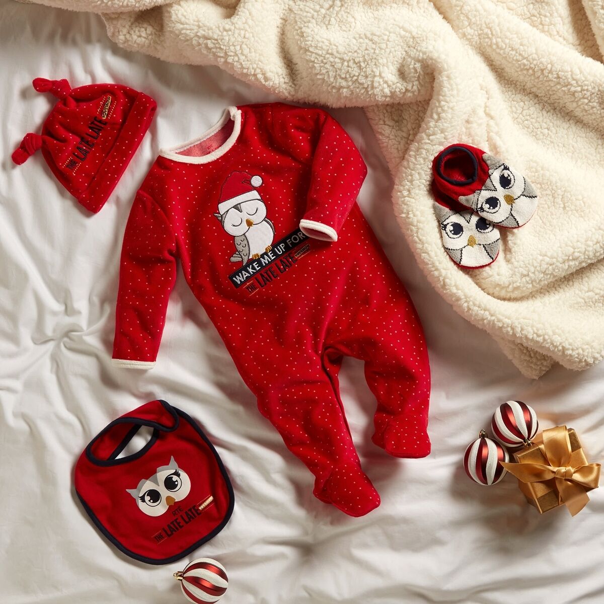 Sleep suit and hat, €10; Footlet, €3.50; Bib, €3 Sleep suit and hat, €10; Footlet, €3.50; Bib, €3
