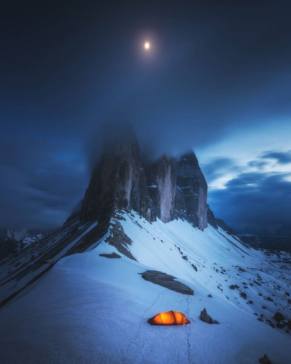 Kuo Zei Yang from Taiwan took an image of fog hovering over the Tre Cime di Lavaredo peaks in the Italian Alps by night. 2019 Sony World Photography Awards