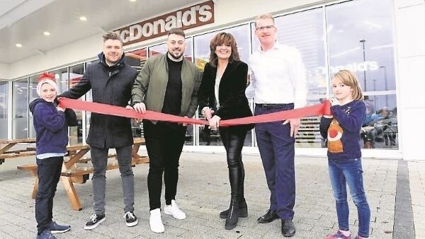The 2 Johnnies joined franchise holders Louise and Chris Pim, and helpers Sean and Ruth O’Flynn cut the ribbon at McDonald’s in Fermoy.