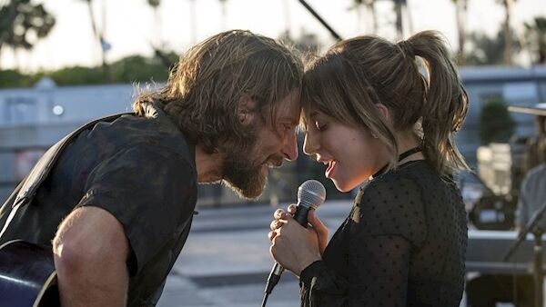 Bradley Cooper as Jackson Maine and Lady Gaga as Ally hit the stage in A Star Is Born.