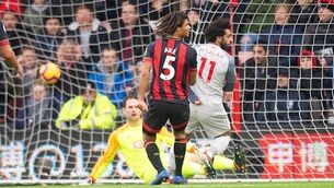 Salah hat-trick sends Reds top, for now