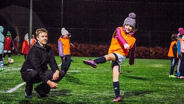 Coach John Lee with daughter Anna as the U11 team are put through their paces. Picture: Brian Arthur