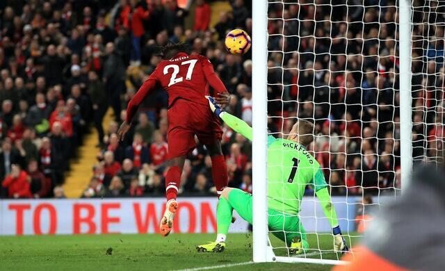 Divock Origi scores the winner against Everton (Peter Byrne/PA)