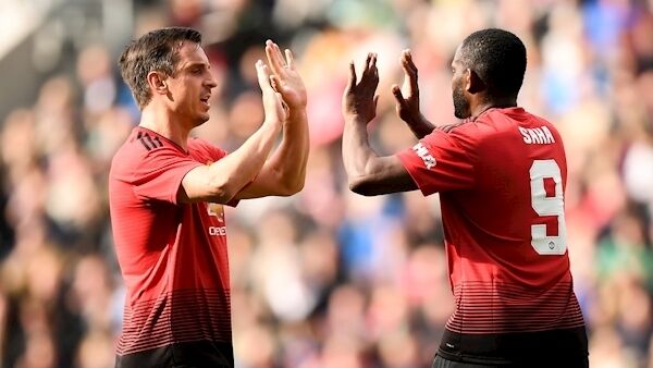 Louis Saha, right, is congratulated by teammate Gary Neville of Manchester United Legends after he scored his scored his second goal during the Liam Miller Memorial match between Manchester United Legends and Republic of Ireland & Celtic Legends at Páirc Uí Chaoimh in Cork. Photo by Stephen McCarthy/Sportsfile