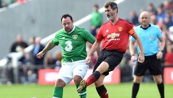Roy Keane clears from Ireland's Andy Reid at the Liam Miller tribute match between Manchester United and Celtic/ Republic of Ireland at Pairc Ui Chaoimh yesterday Picture: Eddie O'Hare