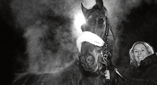 Groom Sinead O’Sullivan with Confrontational after his win in the Mourne Windows & Doors Handicap at Dundalk last night. Picture: Healy Racing