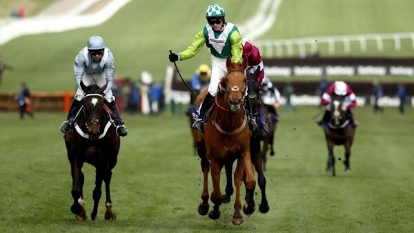 Topofthegame ridden by jockey Harry Cobden (right) wins the RSA Insurance Novices’ Chase (Paul Harding/PA).