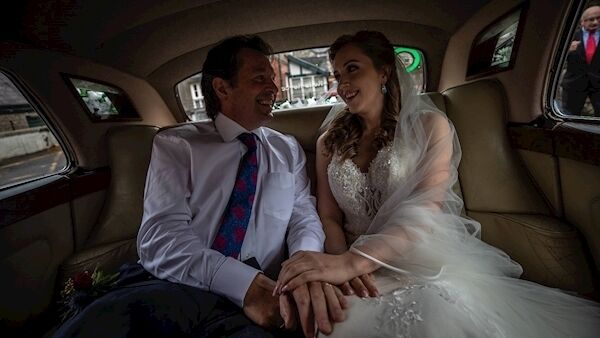 Ileana Wright and her father, singer Finbar Wright, who performed during the wedding Mass.