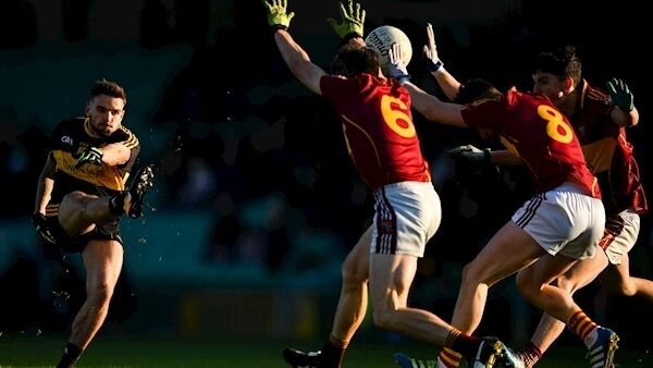 Micheál Burns of Dr Crokes scores a point despite the efforts of Gordon Kelly, left, and Oisin Looney of St Joseph's Miltown Malbay at the Gaelic Grounds. Photo by Eóin Noonan/Sportsfile