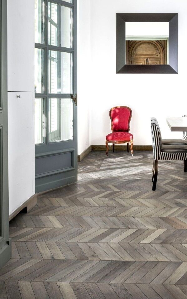 Wood flooring here in engineered parquet will add value as a quality fixture to last decades. Kahrs Oak Chevron in Light Grey (smoked effect), from €130pm, karhs.com