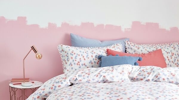 Red is said to stimulate passion but may be too much for a bedroom where sleep is needed. Pink as a paler version offers a more restful option. (Image: Next Interiors)