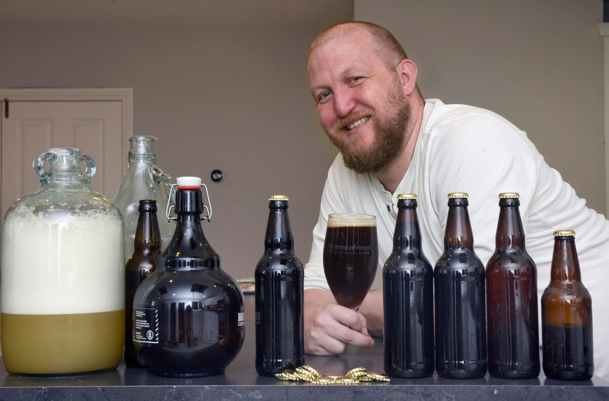 Mick O’Toole raises a glass of his own Russian imperial stout at his home in Naas Co Kildare. He’s part of a movement that advocates grinding your own grain to ferment into beer. Picture: Moya Nolan Mick O’Toole raises a glass of his own Russian imperial stout at his home in Naas Co Kildare. He’s part of a movement that advocates grinding your own grain to ferment into beer. Picture: Moya Nolan