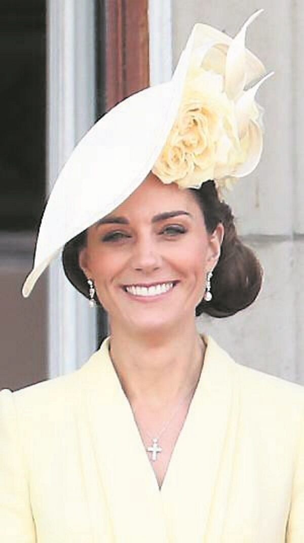 Kate Middleton in one of many Philip Treacy hats. She has also worn Simone Rocha earrings and was an Orla Kiely fan