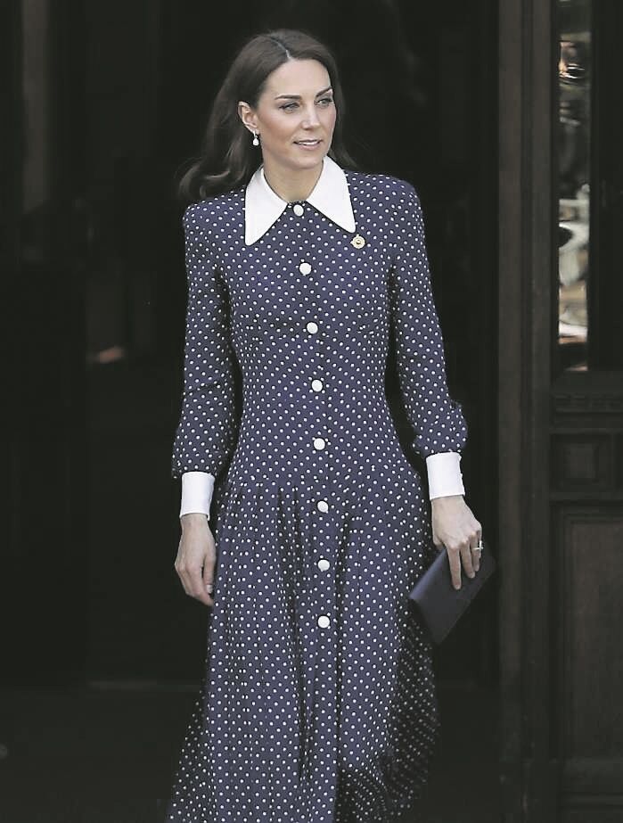 This navy button-down polka dot printed dress is a classic example of Kate dressing on a 'budget' as opposed to couture gowns she dons on formal occasions. She also does her own makeup.