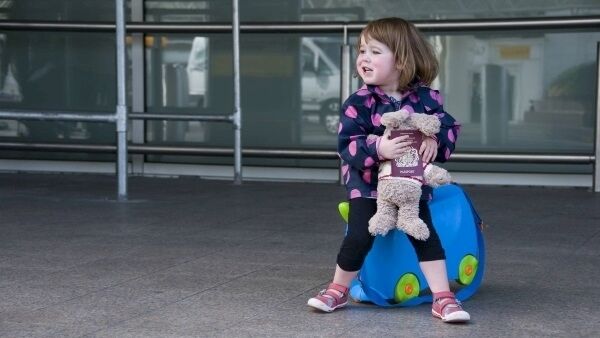 A two year old at airport with UK passport. A two year old at airport with UK passport.