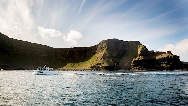 Aquaholics boat passing Port na Spaniagh during a litter pick around the coastline of the Giant's Causeway. Photo:  Liam McBurney/PA