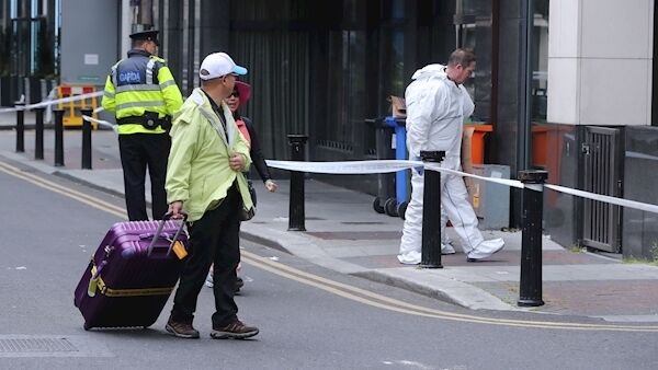 Tourists watch gardai searching Findlater Place near O'Connell Street in Dublin. Photo: Niall Carson/PA. Tourists watch gardai searching Findlater Place near O'Connell Street in Dublin. Photo: Niall Carson/PA.