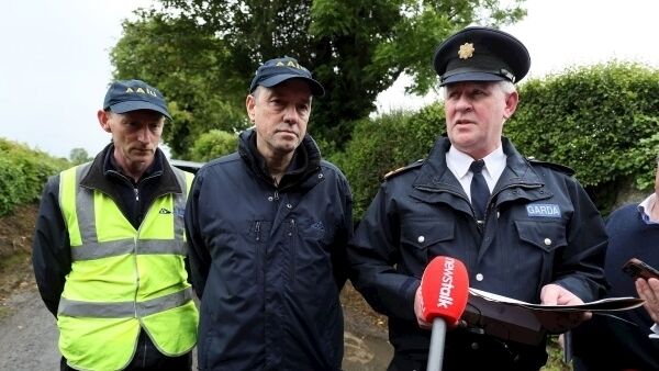 Superintendent Martin Walker (right) along with Howard Hughes (centre) and John Owens, of the Air Accident Investigation Unit, speak to the media near the scene in Belan, Moone, in Co. Kildare. Pic: Brian Lawless/PA Wire