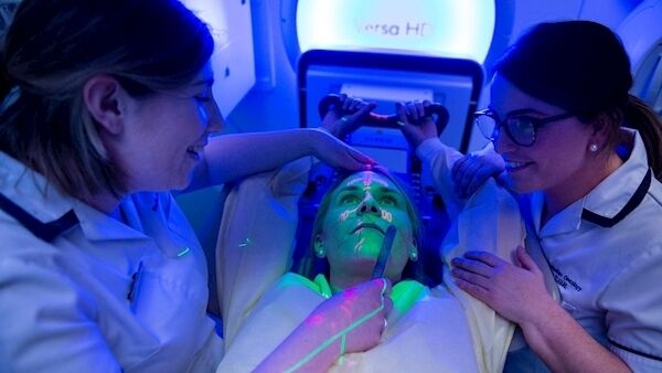 Orla McKivitt, with ‘patient’ Hollie Moffett and Jayne Ide, radiation therapist, at the radiation/oncology centre. Picture: Gerard McCarthy