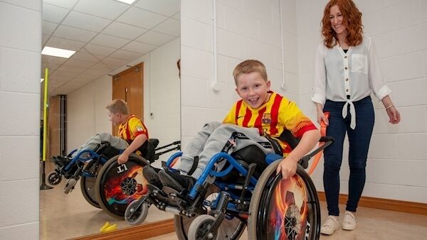 Nine-year-old TJ Lotty from Mayfield performing some wheelies with the help of his instructor, Nicola Delicate. Picture: Brian Lougheed