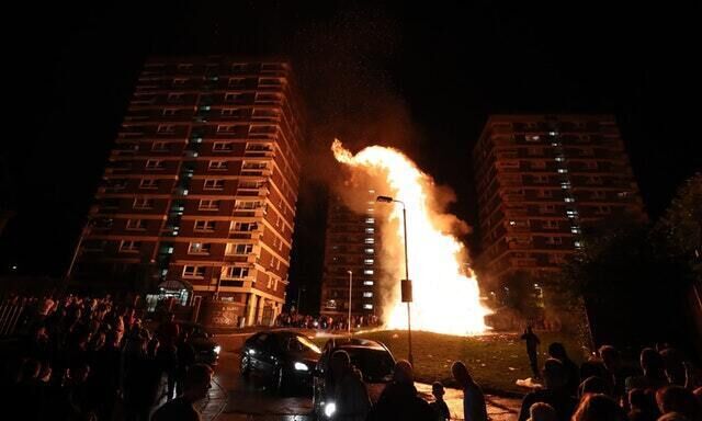 Flames from the bonfire snaked up towards nearby tower blocks (PA)