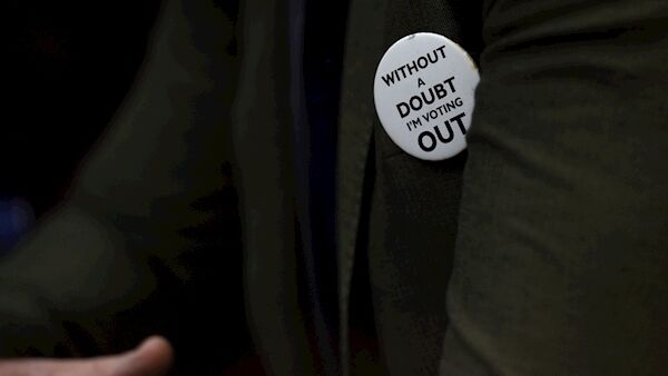 A badge worn by a protester near to the Houses of Parliament in London tonight.