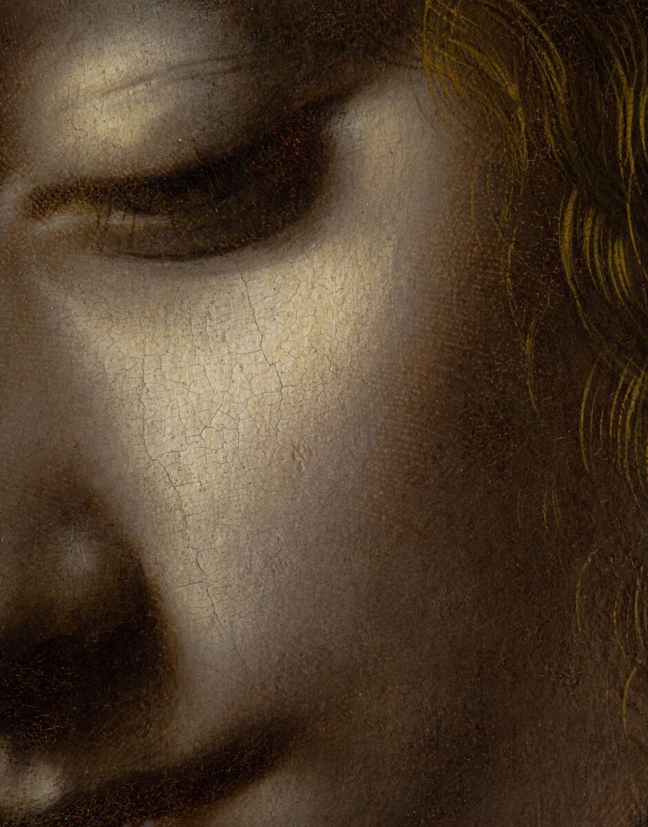 Leonardo da Vinci's artwork The Virgin Of The Rocks, with raking light detail of the Virgin’s eye and cheek including a handprint in the priming layer.