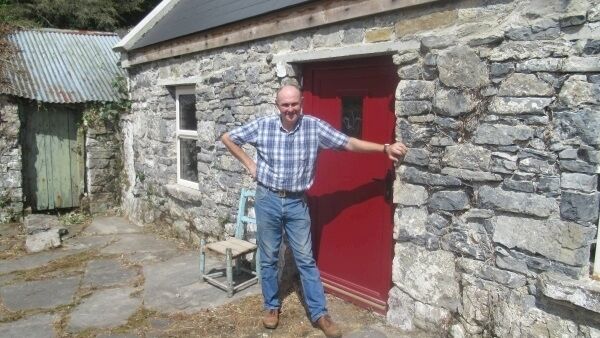 Fintan at the doorway of the family house where he was born and which he is now restoring.